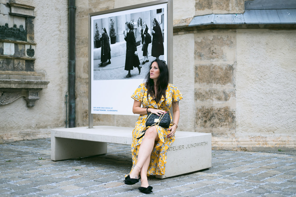 Sommer Outfit mit meinem gelben Wickelkleid mit Rüschen, Kleid von Vero Moda, Michael Kors Handtasche, Mules von H&M, Fashionblog, Modeblog, Blogger Graz, Fashion Blog Graz, Miss Classy